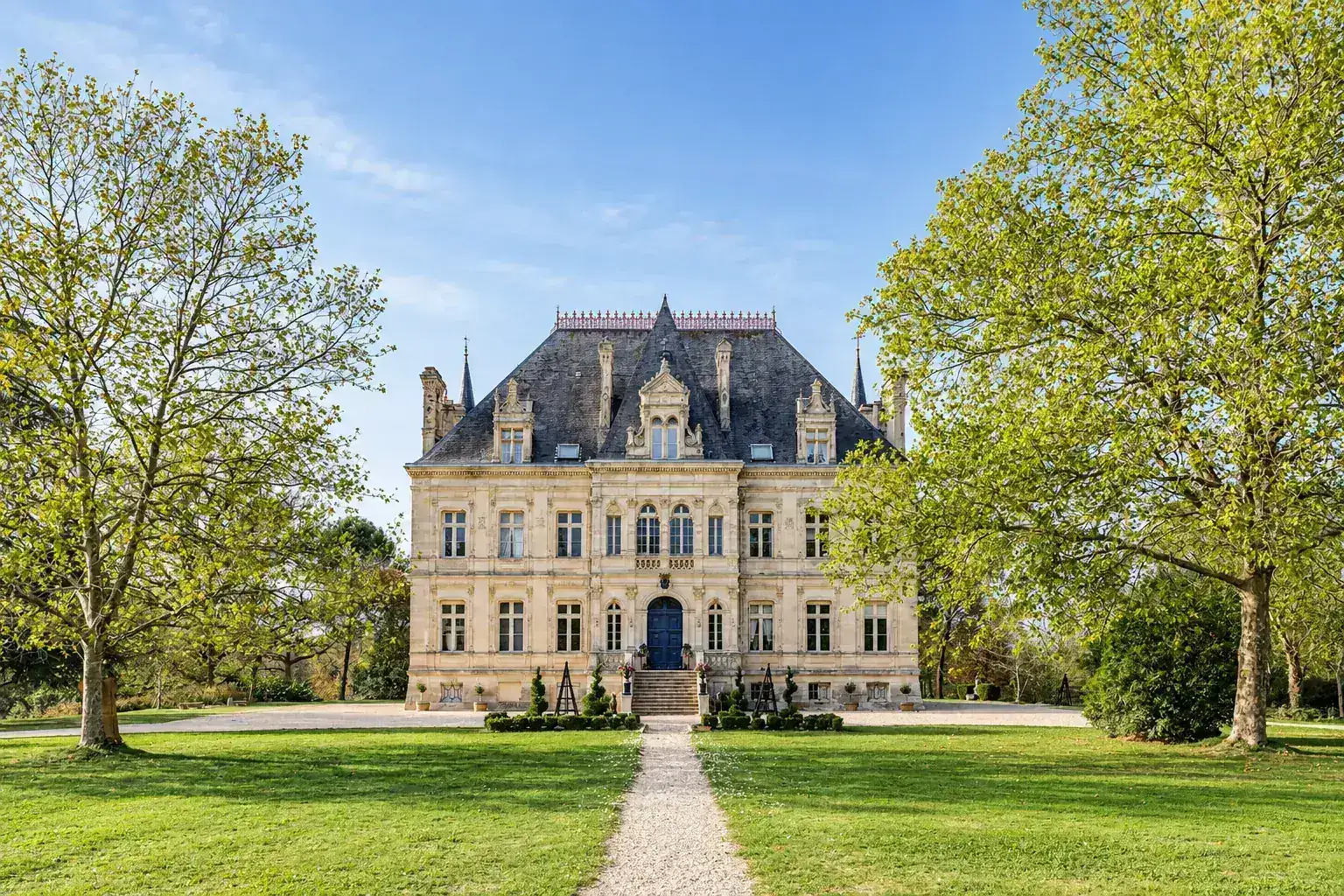 The south front of Château de la Valouze seen across the great lawn